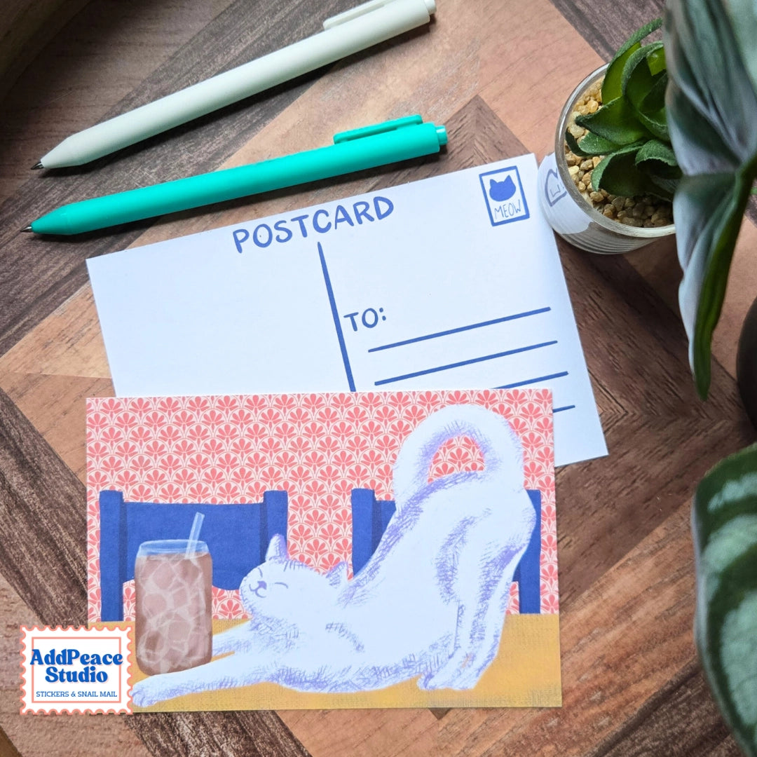 AddPeace Studio - Cats & Cups Postcard Pack
A charming illustrated postcard set for cat lovers, homebodies, and anyone craving a little analog joy. This Cats & Cups postcard pack celebrates quiet moments, warm drinks, and the simple pleasure of sending real mail. Designed for the current resurgence of snail mail, pen pals, and intentional connection, these postcards make it easy (and fun) to go offline on purpose.
Each set includes ten unique 4x6 postcards featuring original Cats & Cups illust