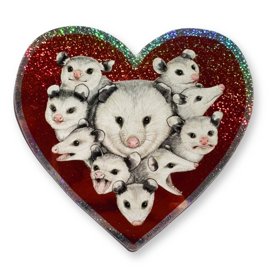 This heart-shaped glittery weatherproof sticker features my illustration of a mom opossum surrounded by her babies.
This die-cut gloss 4” vinyl sticker is durable, weatherproof, and perfect for water bottles, notebooks, laptops, bikes, and all sorts of other surfaces! Make sure to clean and dry the surface thoroughly before applying.
