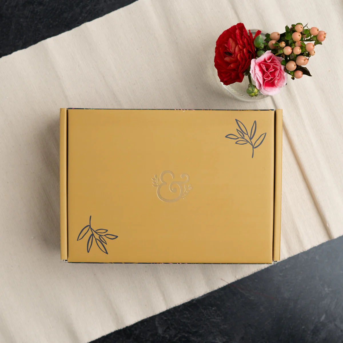 Nurture your creativity with the Flourish Self Care Box, a beautifully curated collection designed with mental wellness in mind. Designed with intention, this box brings together everything you need to begin (or return to) a meaningful creative practice.
Inside you will find:
A5 Bloom & Grow Notebook: featuring a full cover printed abstract floral design, hand stamped with gold foil accents on a vegan leather cover.
Writing Set: including a 0.5mm Ballpoint Pen and Mechanical Pencil with Eraser, both emb
