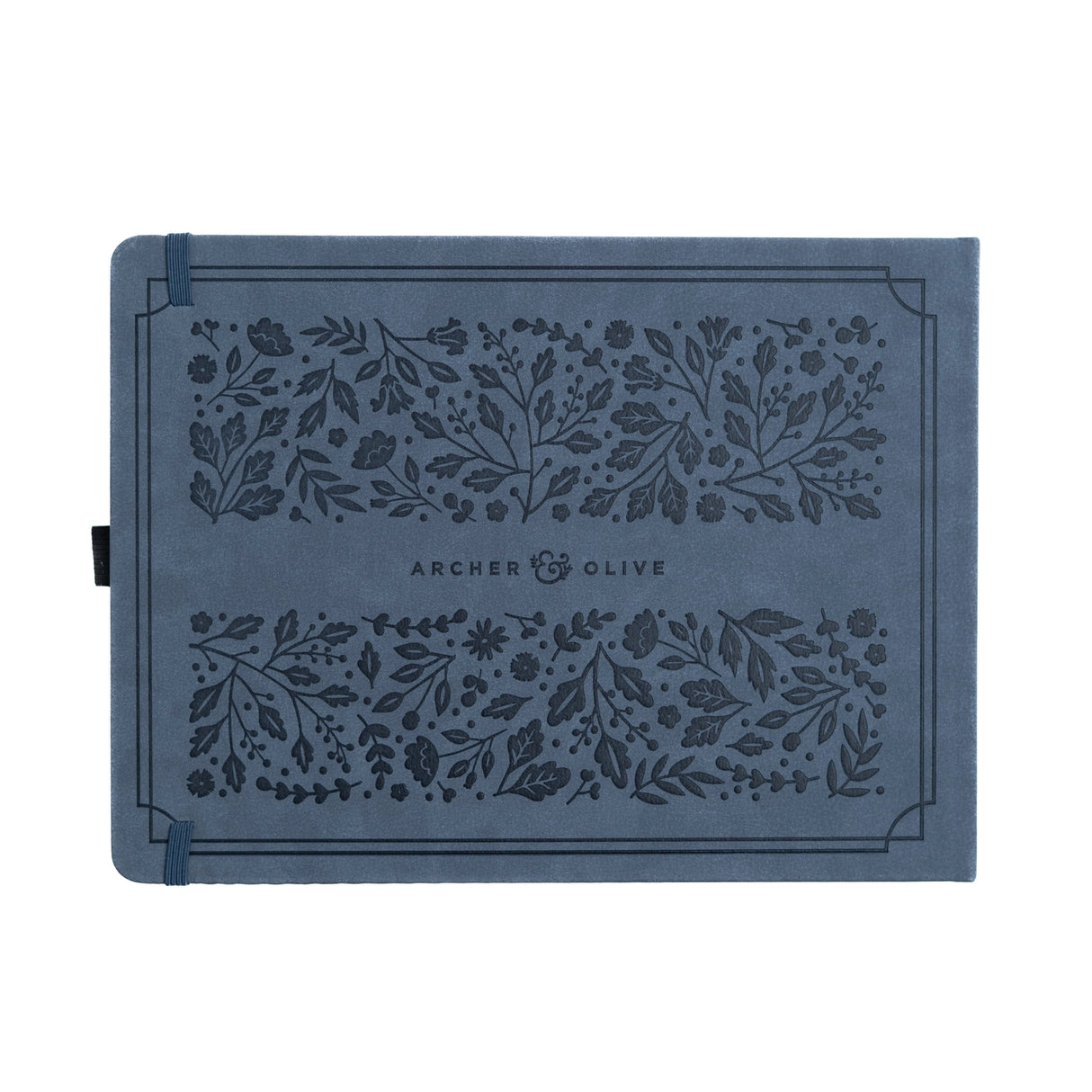 Introducing the Heirloom notebook. This Letter Sized notebook is truly special, featuring a unique full cover design. The intricate foliage pattern and fountain pen is debossed on a suede-like blue vegan leather cover, finished with a vintage rose gold stamping.
This notebook comes with the choice of Dot Grid or Lined pages, and is the perfect journal for a special occasion. From a memory keeping scrapbook to wedding gues