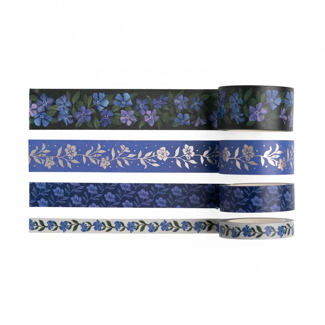 Bring elegant floral charm to every journal spread with the Wild Periwinkle Washi Tape Set.
This coordinating collection of four exclusive washi tapes features hand-painted periwinkle blooms, delicate botanical patterns, and shimmering silver foil accents.