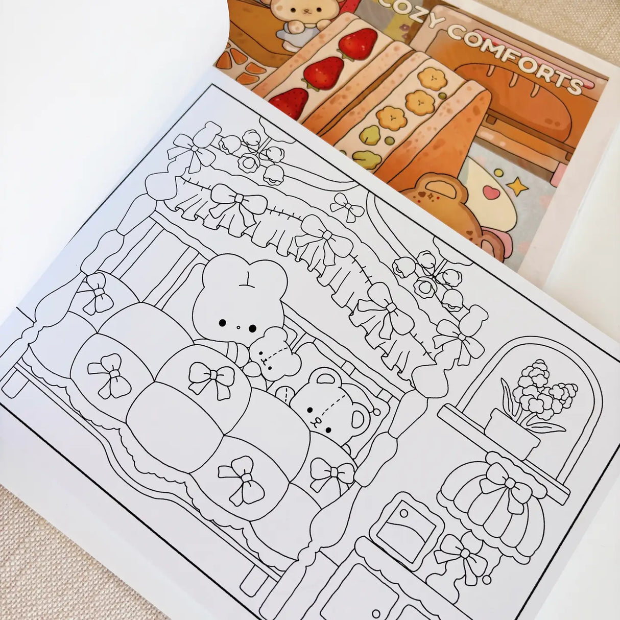 Atelier by Jo Coloring Book Vol. 1 - Cozy Comforts
Unwind and indulge in creativity with the Cozy Comforts Coloring Book – Volume 1 Revamp!
This beautifully refreshed edition features 30 original, full-page illustrations that celebrate the little things that make us feel warm, safe, and happy. Whether you’re curling up on a quiet afternoon or looking for a mindful break in your day, these cozy scenes invite you to relax, reflect, and color at your own pace.
˚ʚ♡ɞ˚ What to Expect:
☆ 30 original illustrati