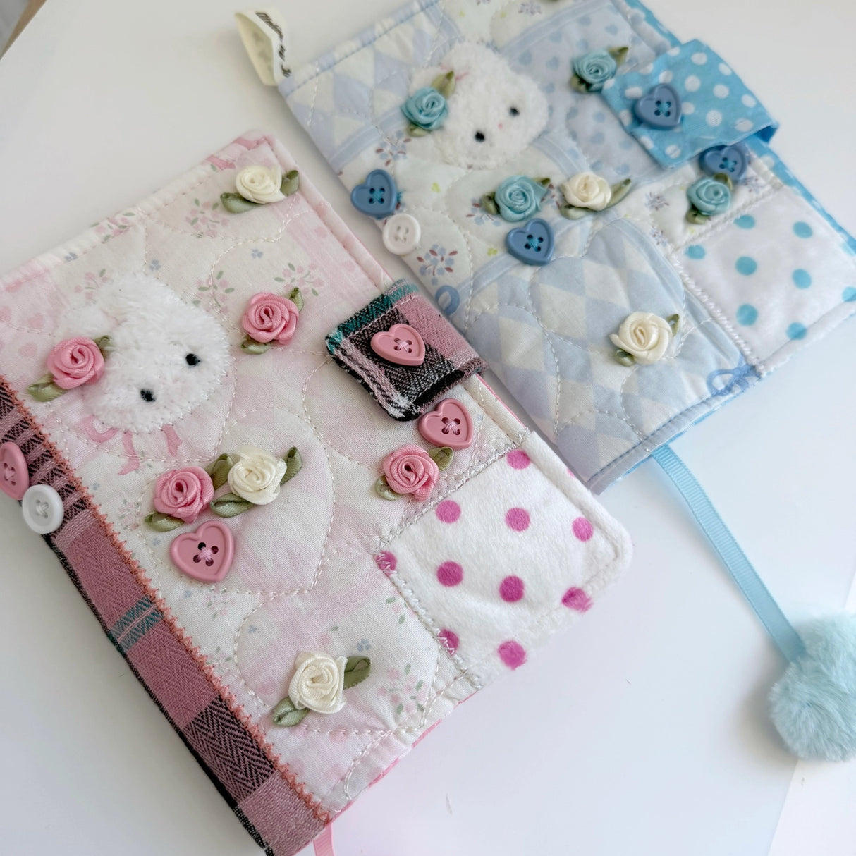 Elevate your journaling experience with these soft and cozy journal covers, designed to protect and personalize your daily diary. Each cover features beautiful blue and pink patterned fabric with thoughtfully sewn details and a secure metal button clasp to keep your pages safe. Includes matching ribbon bookmarks for easy navigation. Available in both A5 and A6 sizes to fit your preferred journal dimensions. The perfect companion for your daily routine and creative practice.