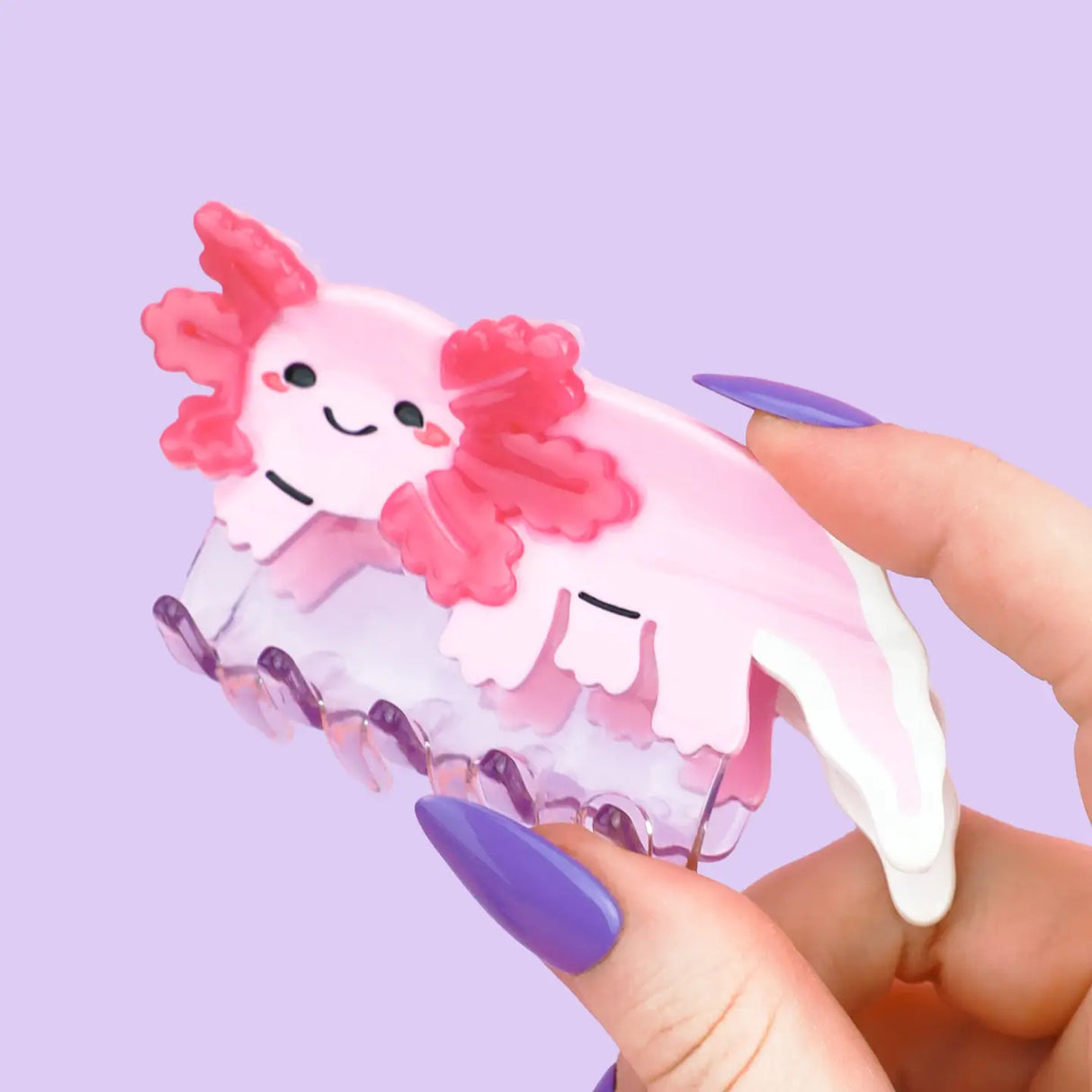 Axolotl Hair Claw' Hair Accessory by Turtle's Soup.
Includes one (1) hair claw
Claw is roughly 3"
3D, engraved, printed, and painted details
High quality acetate material, stronger than standard hair clips
Themed packaging