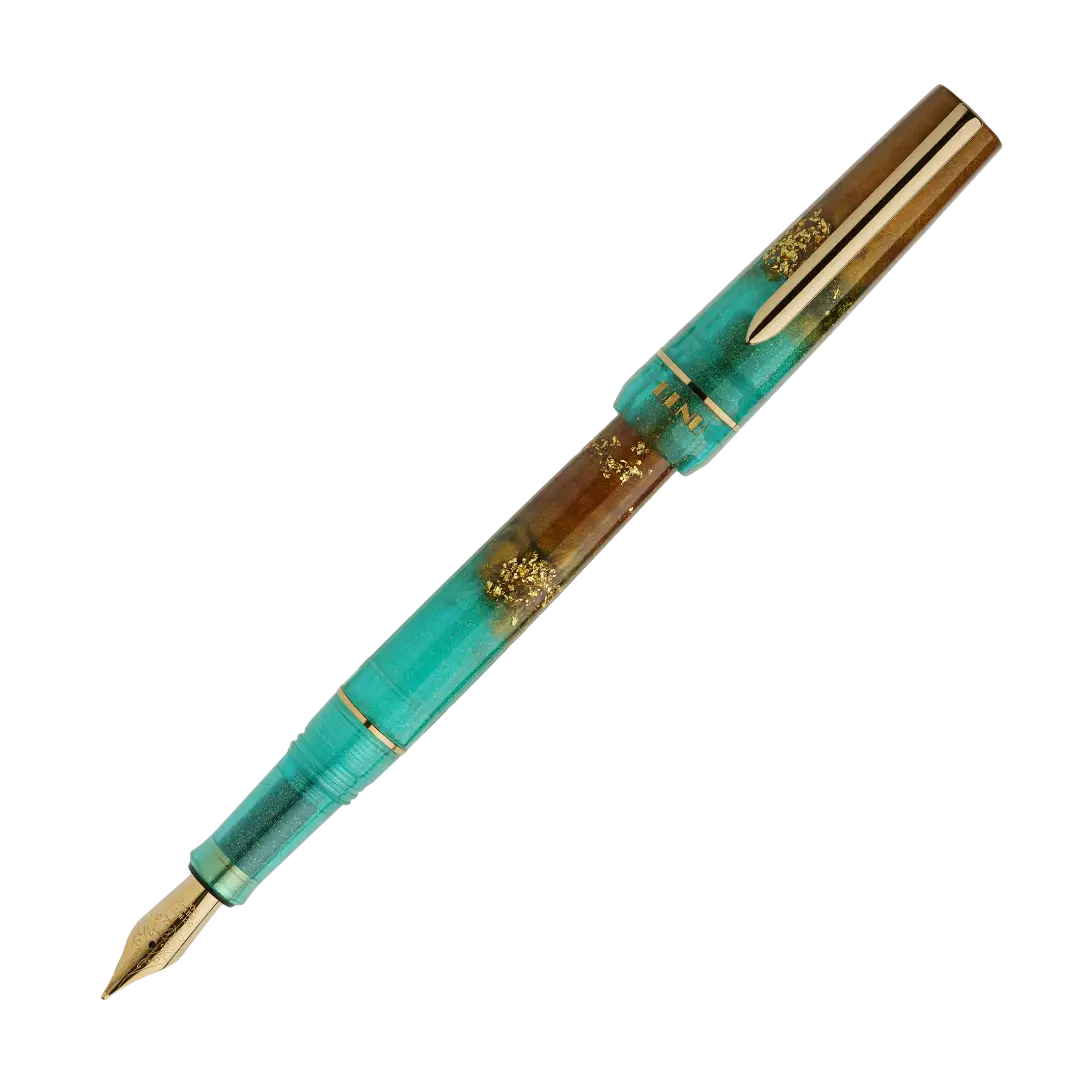 BENU presents the newest Haute Collection — a line of elegant, fashion-inspired pens that blend classic charm with bold, modern flair. The designs include both subtle and vibrant styles, showcasing BENU’s signature glitter and color artistry. Each pen features a faceted body with alternating wide and slender facets, complemented by either gold-plated or chrome-plated trims for a sleek, timeless look.
Seal and caramel tones swirl together, flecked with radiant gold. Lush evokes runway opulence — bold, textu