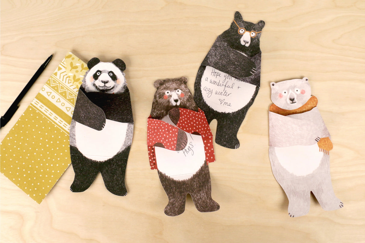 Wrap your message up in a bear hug! With folded hugging arms and scored waists for a seated display, these 12 die-cut bear cards—including polar, panda, brown, and black bears—are ready to send warm thoughts and a big hug for any occasion.
Includes 12 note cards and envelopes
