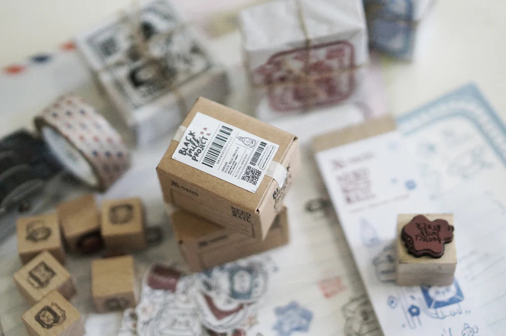 Box size: 4 x 3 x 3 cm
Packed with cuteness, this tiny treasure features 6 different mini stamp designs - plus a PET sticker pack.
The stamps are made of industrial high grade red rubber with the finest details. It is mounted by hand on re-purposed wood, hand-picked from various sources from old furnitures to jungle excursions! As all stamps are assembled, cut, sanded by hand, size and shape may vary slightly. Wood material will differ depending on what the forest elves bring!