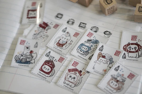 Box size: 4 x 3 x 3 cm
Packed with cuteness, this tiny treasure features 6 different mini stamp designs - plus a PET sticker pack.
The stamps are made of industrial high grade red rubber with the finest details. It is mounted by hand on re-purposed wood, hand-picked from various sources from old furnitures to jungle excursions! As all stamps are assembled, cut, sanded by hand, size and shape may vary slightly. Wood material will differ depending on what the forest elves bring!