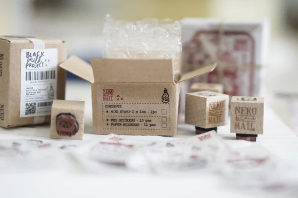 Box size: 4 x 3 x 3 cm
Packed with cuteness, this tiny treasure features 6 different mini stamp designs - plus a PET sticker pack.
The stamps are made of industrial high grade red rubber with the finest details. It is mounted by hand on re-purposed wood, hand-picked from various sources from old furnitures to jungle excursions! As all stamps are assembled, cut, sanded by hand, size and shape may vary slightly. Wood material will differ depending on what the forest elves bring!