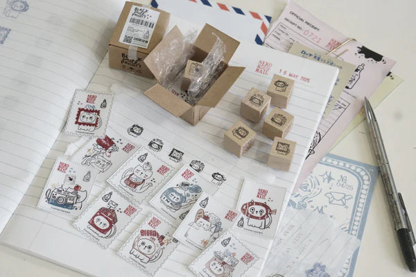 Box size: 4 x 3 x 3 cm
Packed with cuteness, this tiny treasure features 6 different mini stamp designs - plus a PET sticker pack.
The stamps are made of industrial high grade red rubber with the finest details. It is mounted by hand on re-purposed wood, hand-picked from various sources from old furnitures to jungle excursions! As all stamps are assembled, cut, sanded by hand, size and shape may vary slightly. Wood material will differ depending on what the forest elves bring!