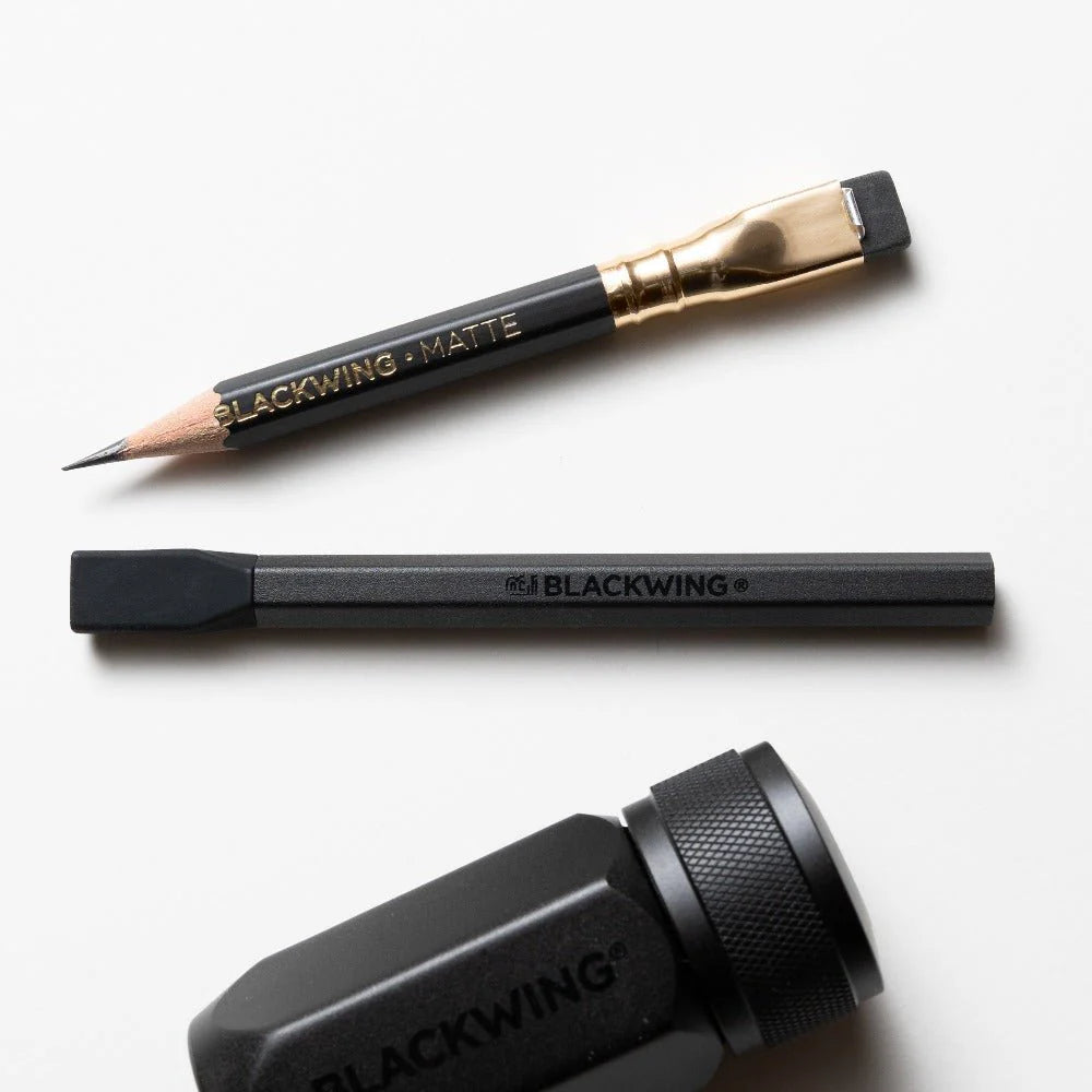Breathe new life into those pencil nubs you've been saving and prolong the lifespan of your Blackwings with the Pencil Extender. The simple design allows the extender to slide into the clip of the existing Blackwing ferrule. The extender works with all Blackwing pencil models.
Each Blackwing Pencil Extender is made with machined aluminum and features a firm rubber tip to ensure a snug fit, making it feel like you’re holding a regular pencil.