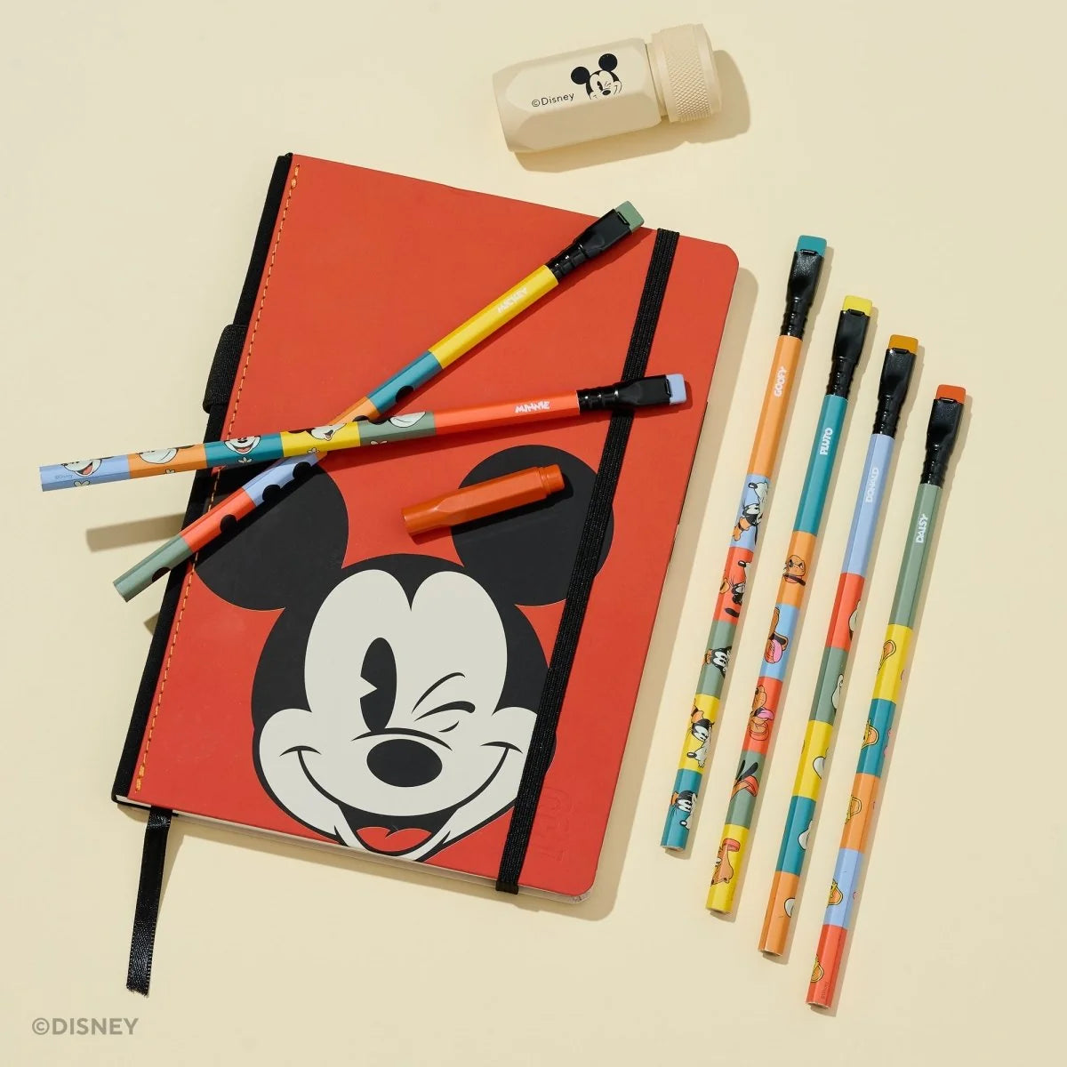 This Notebook Essentials Set includes 6 Blackwing pencils featuring Mickey Mouse, Minnie Mouse, Pluto, Goofy, Donald Duck, and Daisy Duck. It also includes a Mickey Mouse Pencil Sharpener, a Mickey Mouse Point Guard, and a medium Mickey & Minnie Mouse notebook with blank paper.