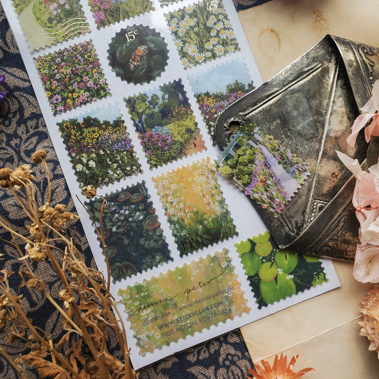 🌼🌷 Stop and smell the flowers in @denaisx’s radiant garden, where every corner bursts with color and life. From golden fields of daisies to secret garden walkways framed in pink blooms, this sheet is filled with nature at its most joyful and abundant. Romantic, vibrant, and endlessly wander-worthy, these stickers will bring the magic of a garden in full bloom straight to your pages.
Art by: @denaisx
Top Coating: None
Adhesive Layer: PVC (plastic)
Backing Layer: Clear PET
6.69" x 3.54".
Weight - 0.03lbs.