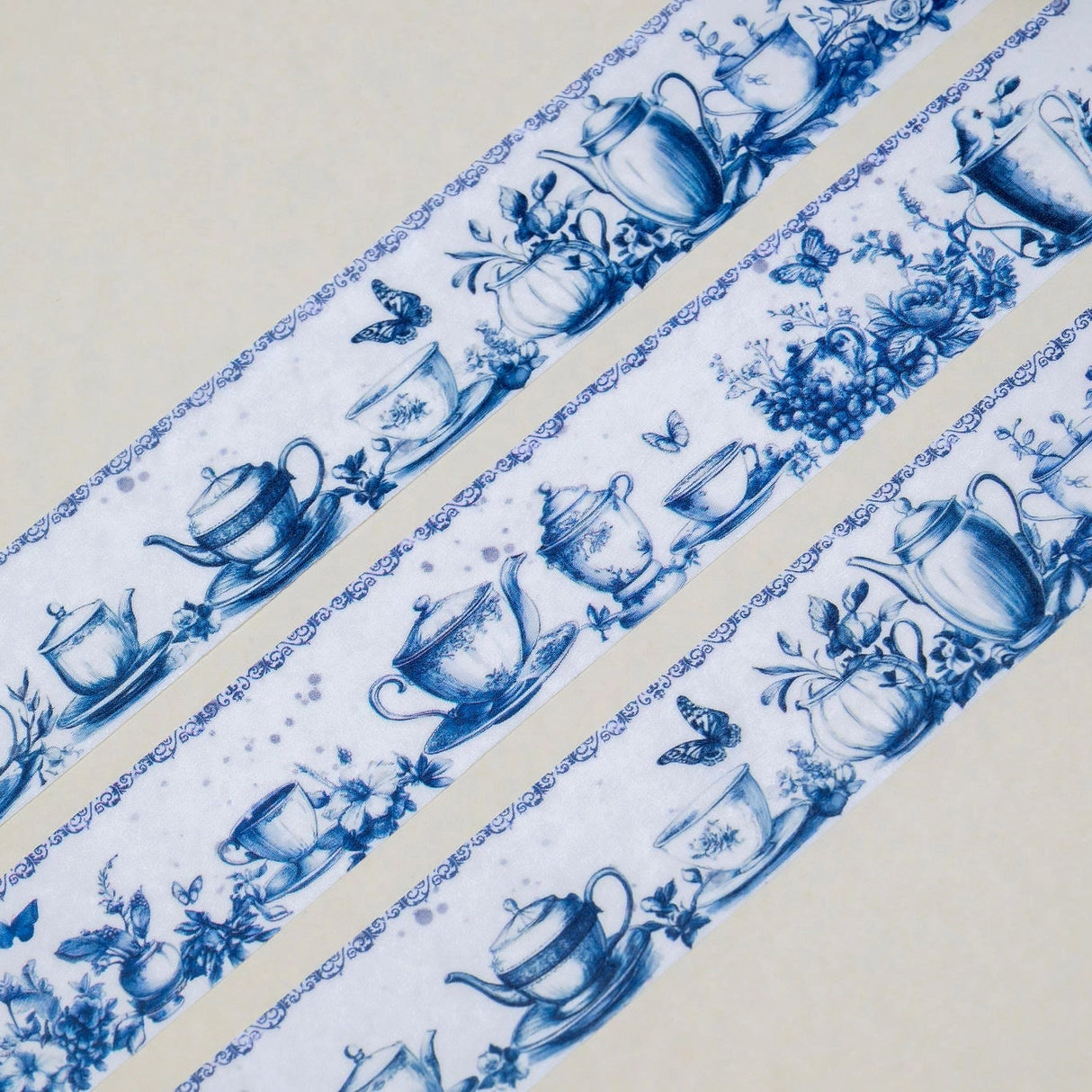 A unique vintage style washi tape featuring some dreamy tea party inspired blue patterns on a white background. Size: 2cm x 10m