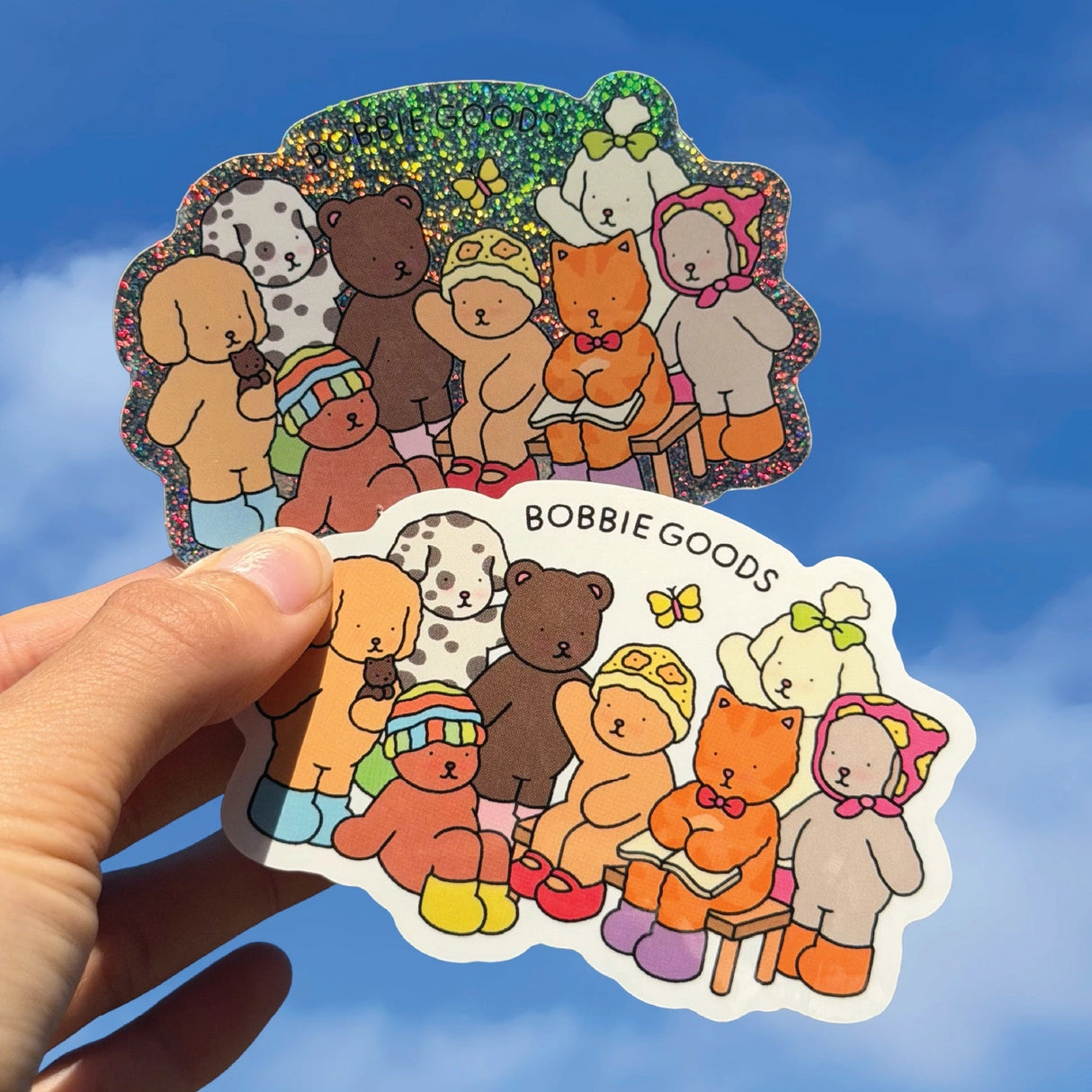 Bobbie Goods Glitter Vinyl Sticker - Bobbie Goods Family
1 vinyl sticker
Weatherproof
Gloss finish
Approximately 3.5" x 2.5"