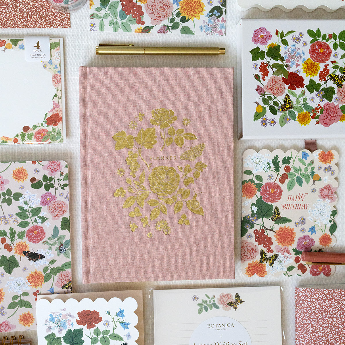 Herbarium | Linen-Bound Undated Planner
Hand-illustrated luxurious undated planner
Size: 6.25"x 8.5" x 0.75"
Lay-flat binding
Cover printed in full color and gold foil stamped
Matte gold foil-gilded edges ~ Full-color Book linen cloth
Illustrated inner pages
2 satin bookmarks
120 gsm natural white interior pages
Back pocket
Undated with room for 12 months
Birthdays and Special events spread
Monthly view located at the start of each month.
Weekly view
Notes pages