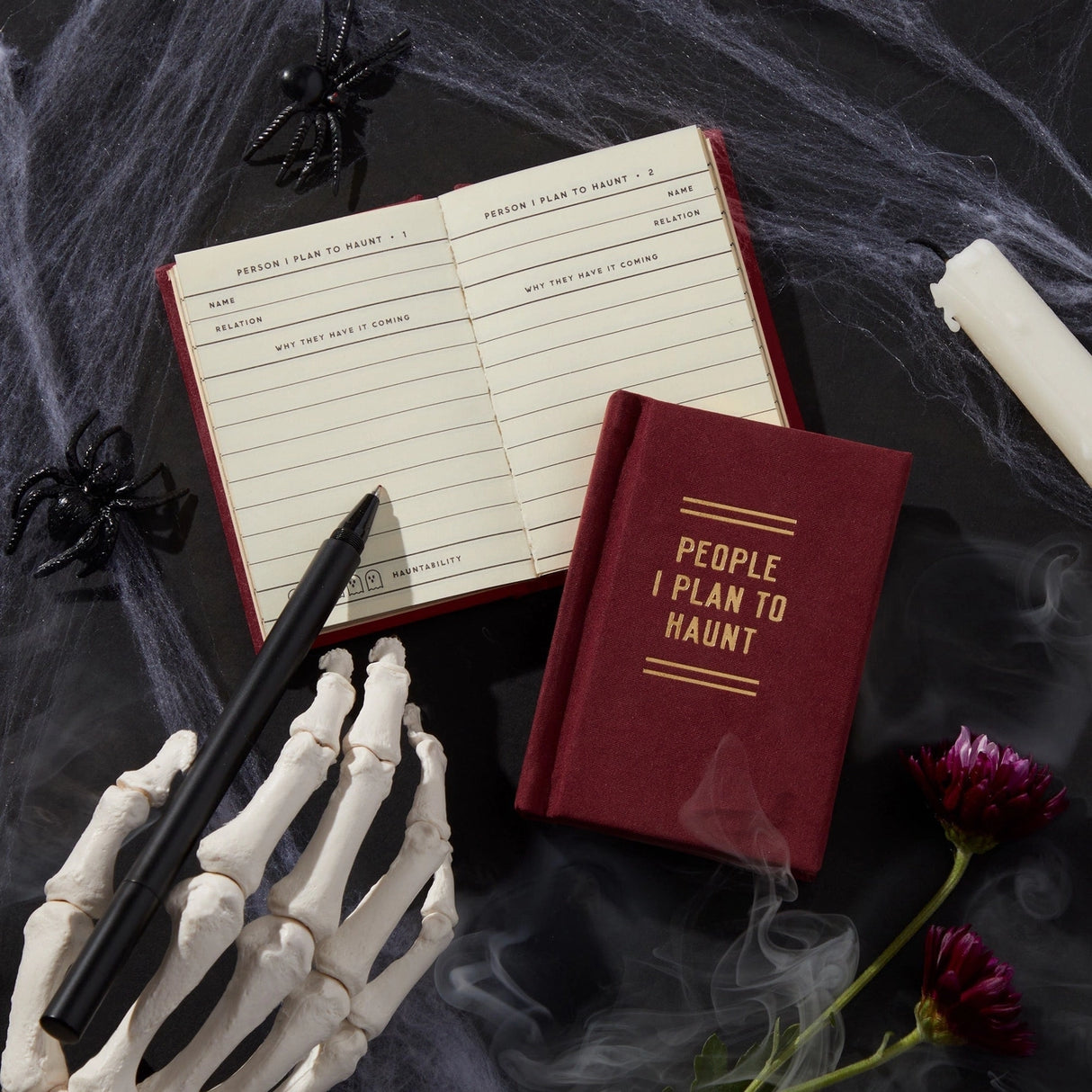 Finally, a pocket-sized place to keep track of your posthumous priorities. Whether it’s petty grudges, unresolved drama, or just a running list of people who deserve a little ghostly mischief, this 2.75” by 3.75” diary is your future haunting blueprint. With 112 gilded-edge pages, it’s the perfect mix of elegance and eerie intent.
Styled with nostalgic flair and a touch of the macabre, this diary channels old-school stationery vibes with just enough spooky sass. It’s ideal for chronicling your spectr