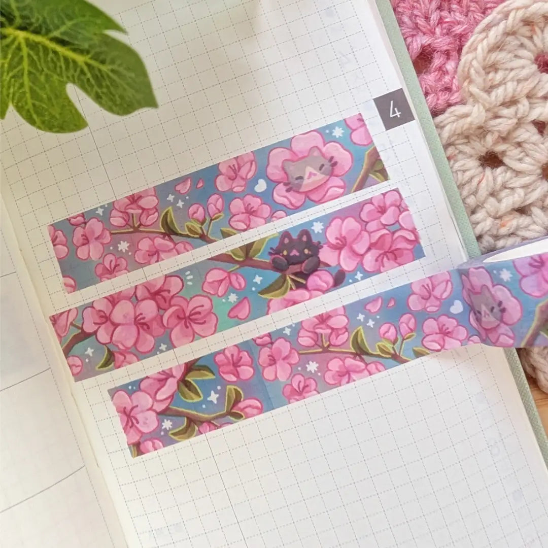 A washi tape inspired by cherry blossoms! Each roll of washi tape is 15mm (approximately 0.59 inches) wide and 10 meters (approximately 10.9 yards) long.
Washi tapes have a small labeling sticker with branding and design, but without extra packaging.