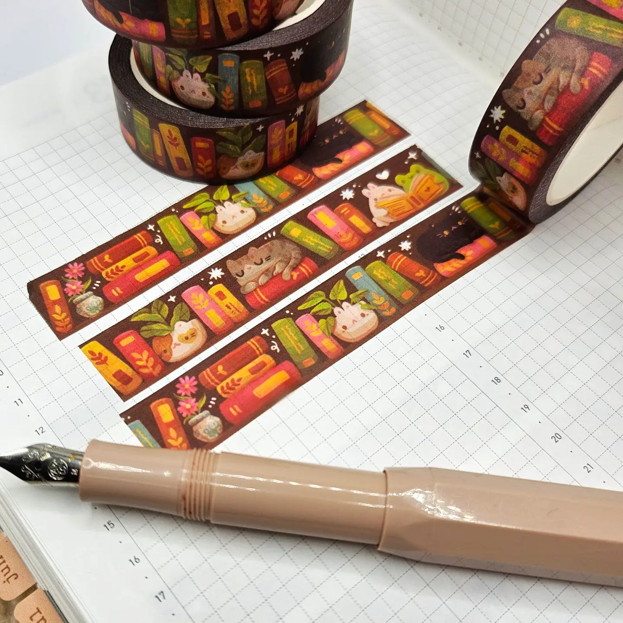 A washi tape inspired by bookish things! This is a reprint of an older design - the colors are a little brighter this time. Each roll of washi tape is 15mm (approximately 0.59 inches) wide and 10 meters (approximately 10.9 yards) long.
Washi tapes have a small labeling sticker with branding and design, but without extra packaging.