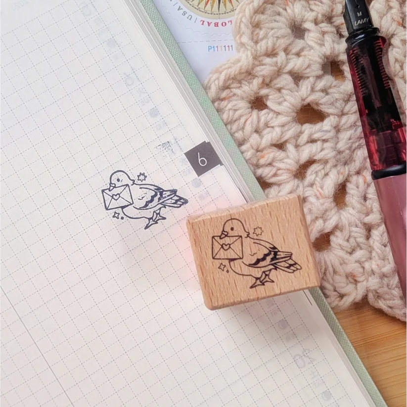 A small wood stamp of a little pigeon delivering your mail for your planner and scrapbooking needs. Each stamp measures approximately 1 x 0.75 inch.
Stamps come loose and without any extra packaging.