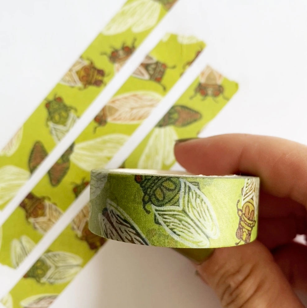 Our cicada washi tape is a vibrant green tape created in homage to the loudest bug on the block: the cicada! This is a lightweight decorative tape printed on traditional rice paper. It is removable and leaves no residue, making it perfect for scrapbooking, stationery, crafts and more. Featuring a collection of complementary nature inspired designs that bring a pop of color to all your projects! Perfect for gifting and arts + crafts displays.
Tape dimensions: 15mm x 10m, or 0.59” x 32.8’