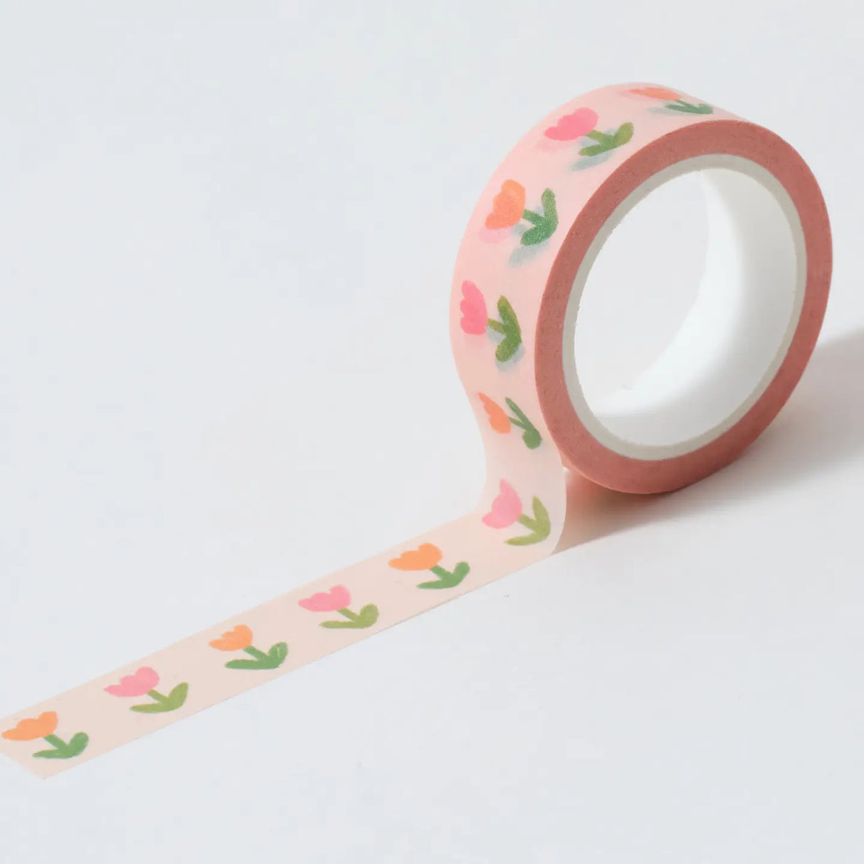 Cute floral wash tape in a pastel peach colour tone with pink and orange tulips.
This paper tape is perfect for decorating your bullet journal and planners, scrapbooking & gift wrapping. It'll add some fun and colour to any surface and is easy to peel off.