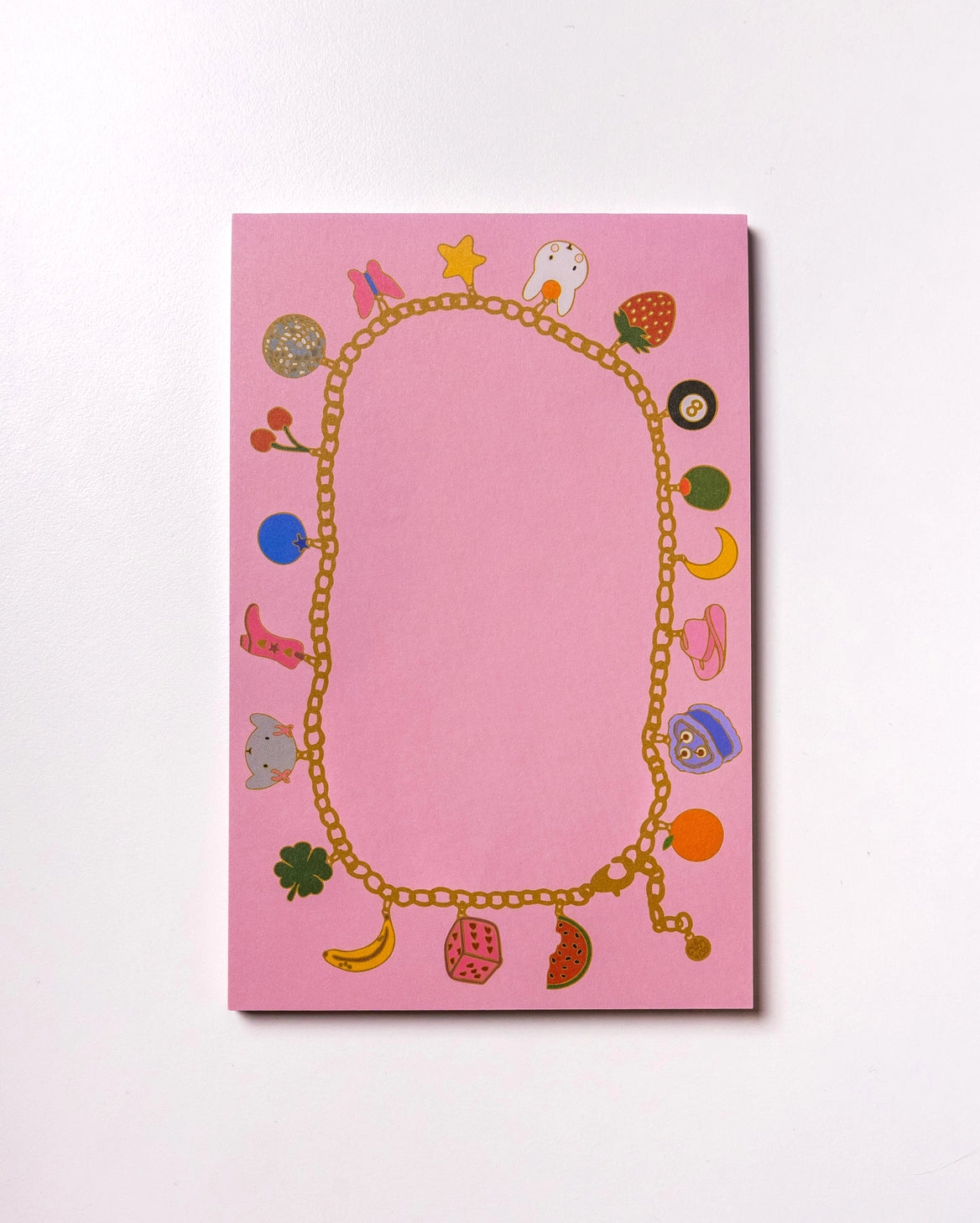 Charmed By Clem Notepad by Clem & Co.
Clem the Bun loves to make charm bracelets for all her friends! However, she kept forgetting which of her friends she had already given them to, so she made a notepad to keep track. Jot down things you don't want to forget either on this charming little notepad!