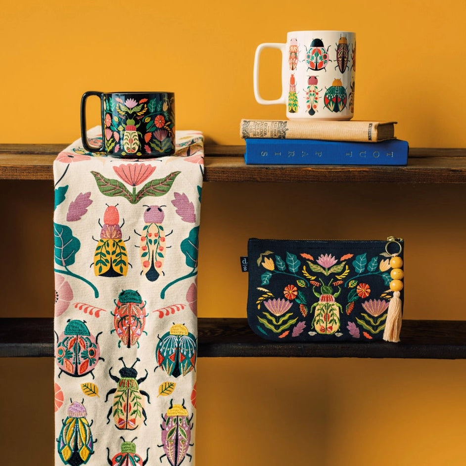 Danica Studio Small Zipper Pouch - Amulet
Safeguard your tiniest prized possessions under the watchful eye of a sacred scarab beetle with our Small Amulet Zip Pouch. Carefully embroidered on a background of durable black cotton, powerful talismans from the past stand vigil, protecting the things you most value.
Size: W7 x L4.5in
Material content: 100% Cotton, Polyester Embroidery
Care instructions: Spot clean only
Includes 1 zipper pouch