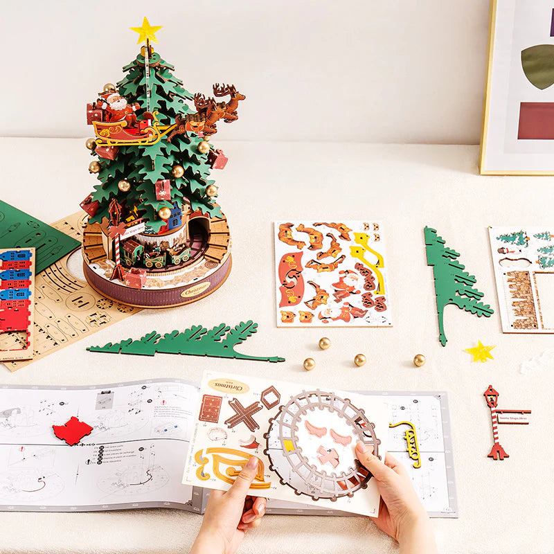 Bring the holiday magic to life with our DIY 3D wooden puzzle! Featuring a beautifully crafted Christmas tree, Santa in his sleigh, and adorable reindeer, this puzzle adds festive charm with a little train chugging around the tree.
Assemble the pieces and enjoy the satisfying click of each fit. Once complete, wind it up to hear "We Wish You a Merry Christmas," "Jingle Bells," and "Deck the Halls."