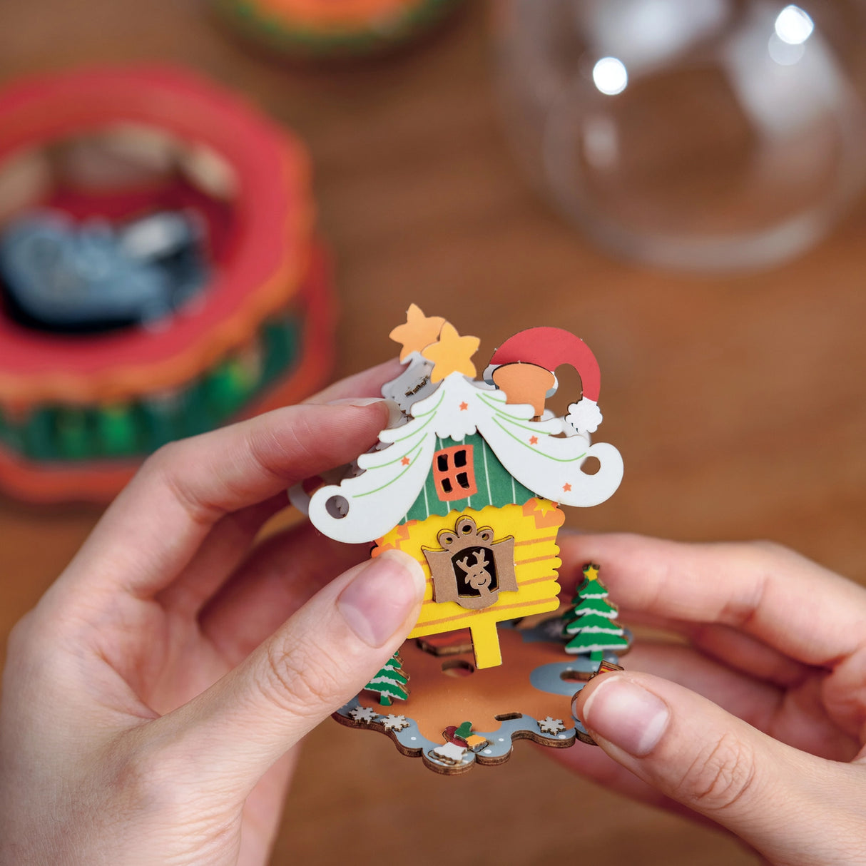 Step into the magic of the holiday season with our DIY Miniature Christmas Snow Globe Kit, featuring Santa's enchanting little workshop! This delightful kit allows you to create a whimsical scene where Santa and his cheerful elves are busy crafting toys and spreading joy.