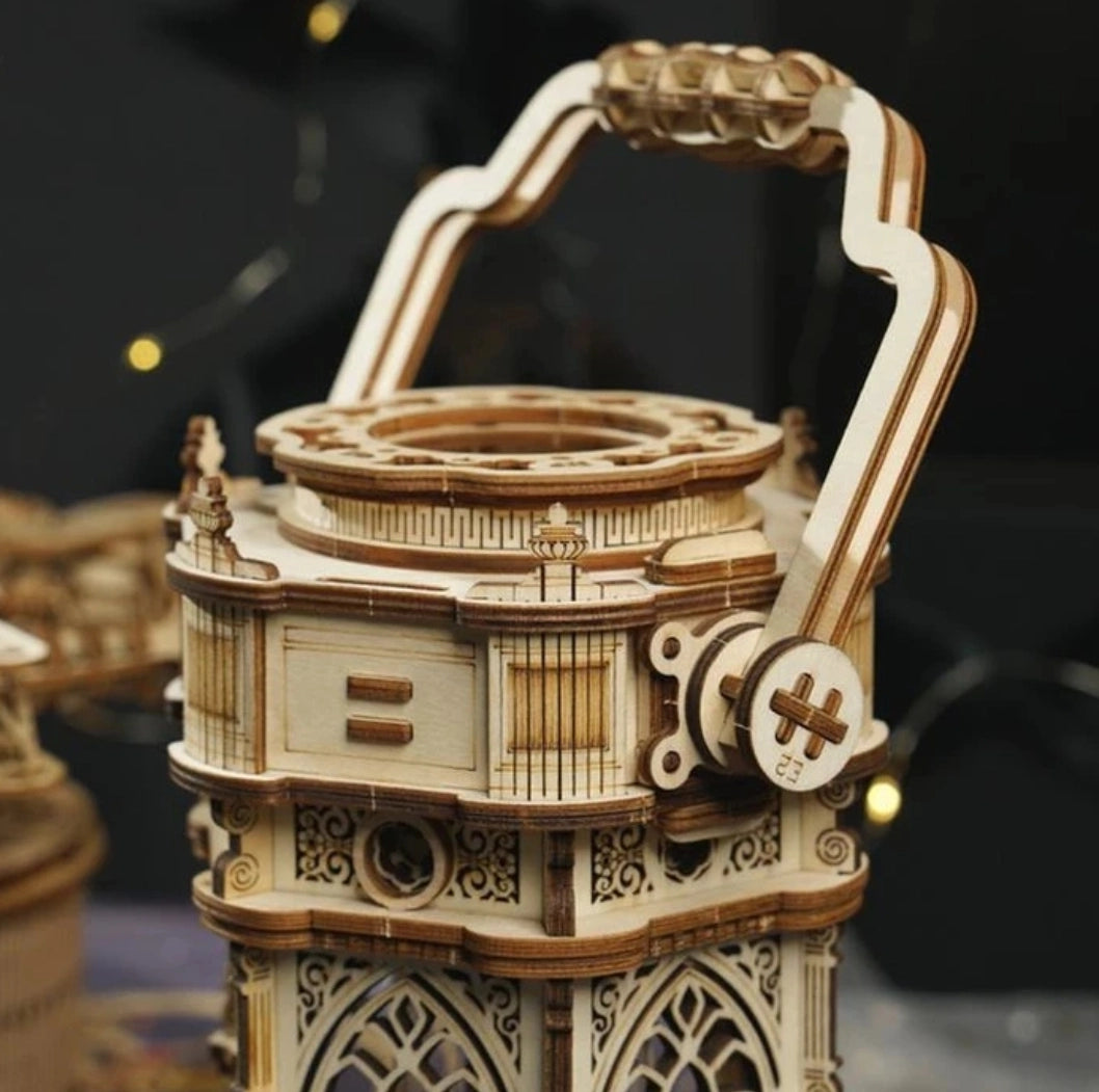 This ornate lantern DIY music box lights up as well as plays to the melody of "YOU LIGHT UP MY LIFE" after being wound up.
• Music box tune: YOU LIGHT UP MY LIFE
• Assembled size: 140 x 115 x 300mm.
• Pieces: 210 pcs.
• Age range: > 14 years old