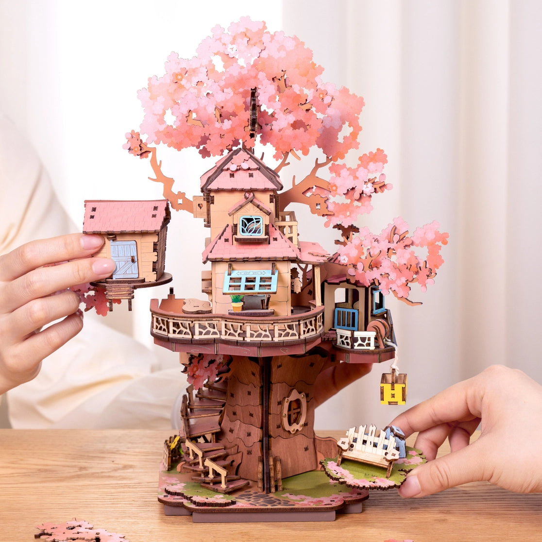 Craft a fairy sakura-scented retreat with this Rolife 3d puzzle! Delicate cherry blossoms, a swing, spiral stairs & lift basket channel —no plastic, just soul-soothing wood. The miniature kit brings adventure fantasies to life.
535-piece 3d puzzle click snugly without glue—just gentle pressure! (no nail-breaking snaps!). Enjoy 5 hours of immersive, stress-relieving fun with the miniature kit. Perfect for unwinding after work or sharing quality time with family.