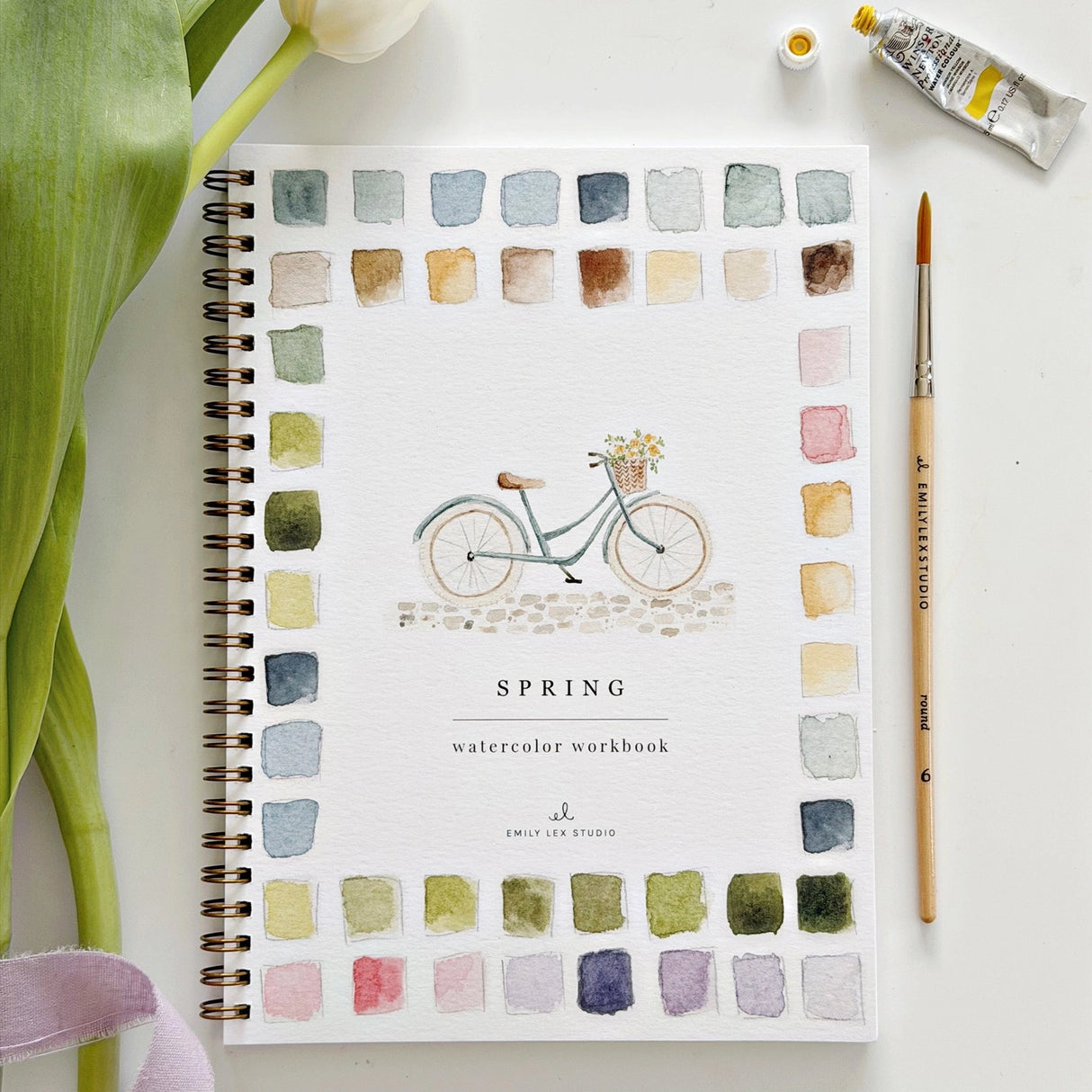 Twelve spring illustrations — a bunny, baby chick, tulips, lilacs, an Easter basket, a bicycle with flowers, and more — each pre-outlined with step-by-step instructions. Paintings take about thirty minutes from start to finish, making it approachable for first-time painters and a favorite for gifting.
Enjoy this peaceful painting hobby on your own, with children, or with friends. Makes a wonderful gift and is perfect for artists of any age.
Details:
12 beginner-friendly illustrations
Thick 120lb watercolo