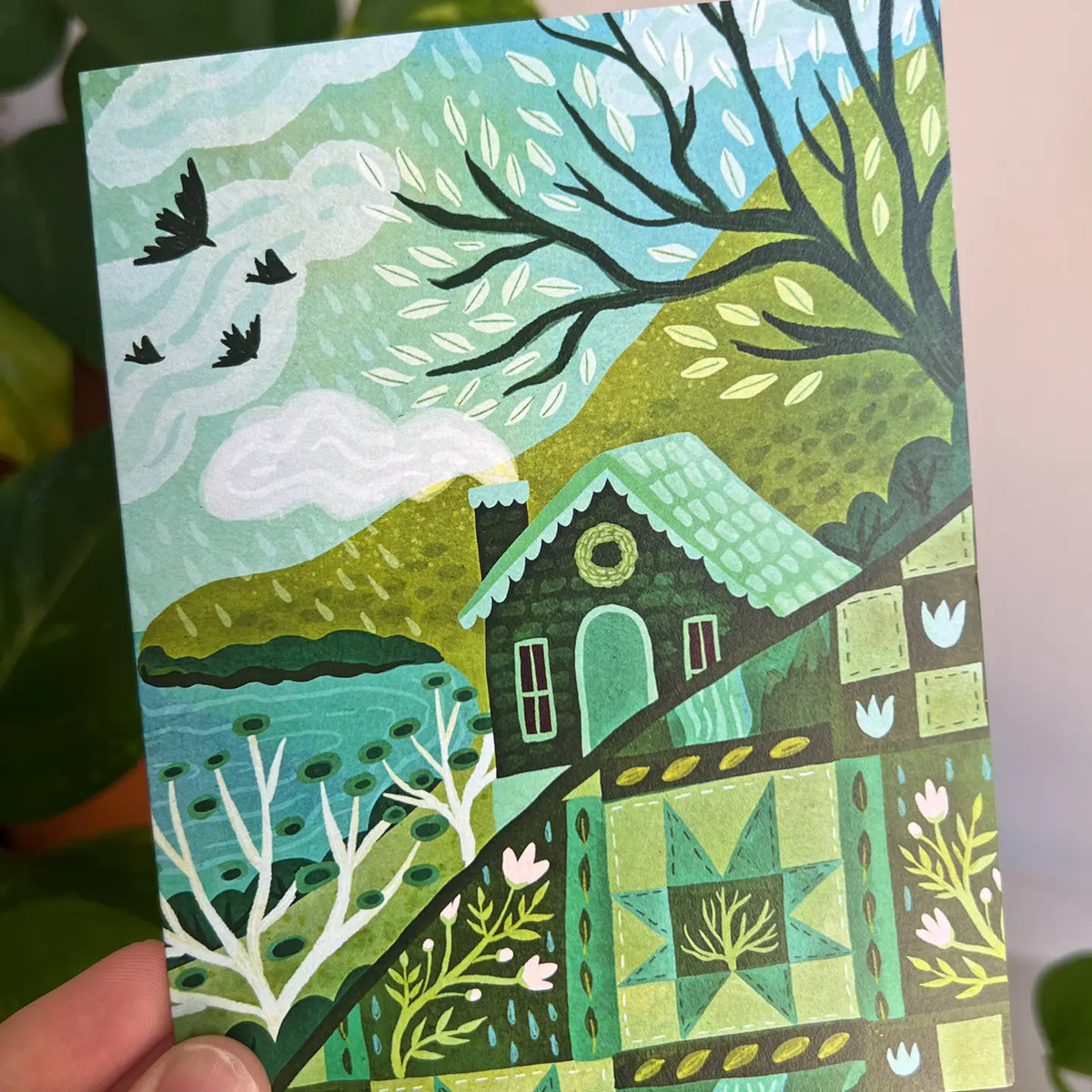 Emmylou Illustrations - Cozy Cottage Greeting Card
Spring greeting card featuring a quilt pattern and a cozy cottage. Perfect for anniversaries, birthdays, Mother’s Day, or just because! All greeting cards are hand illustrated by me!
Printed on premium heavyweight matte cardstock, this A2 card is blank inside—ready for your handwritten notes.
Includes a kraft envelope