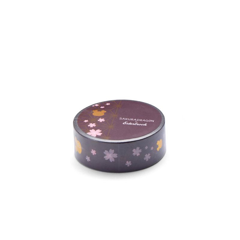 Esterbrook x Sakuradragon Washi Tape - Sakura
The Sakura Washi Tape celebrates the blossoms and tiny characters that give Sakura Street its playful character. Created from original artwork by Cindy Duong, the 1.5 cm-wide design features Sakura flowers and the artist's Sakura Dragon accented in gold foil. Each roll contains five meters of washi tape.