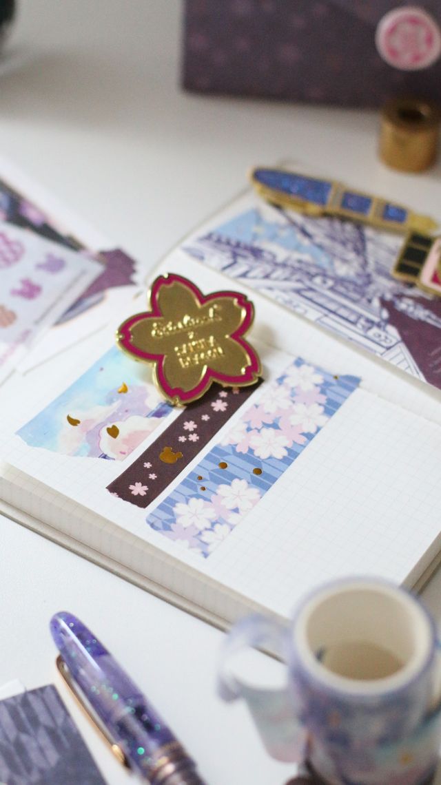 Esterbrook x Sakuradragon Washi Tape - Sky
The Sky Washi Tape turns Cindy Duong's Sakura Street Sky illustration into a continuous scene. Soft clouds and rooftops fill the 3.5 cm-wide tape, with gold foil details appearing throughout the design. Each roll contains five meters for decorating journals, letters, and stationery projects. 