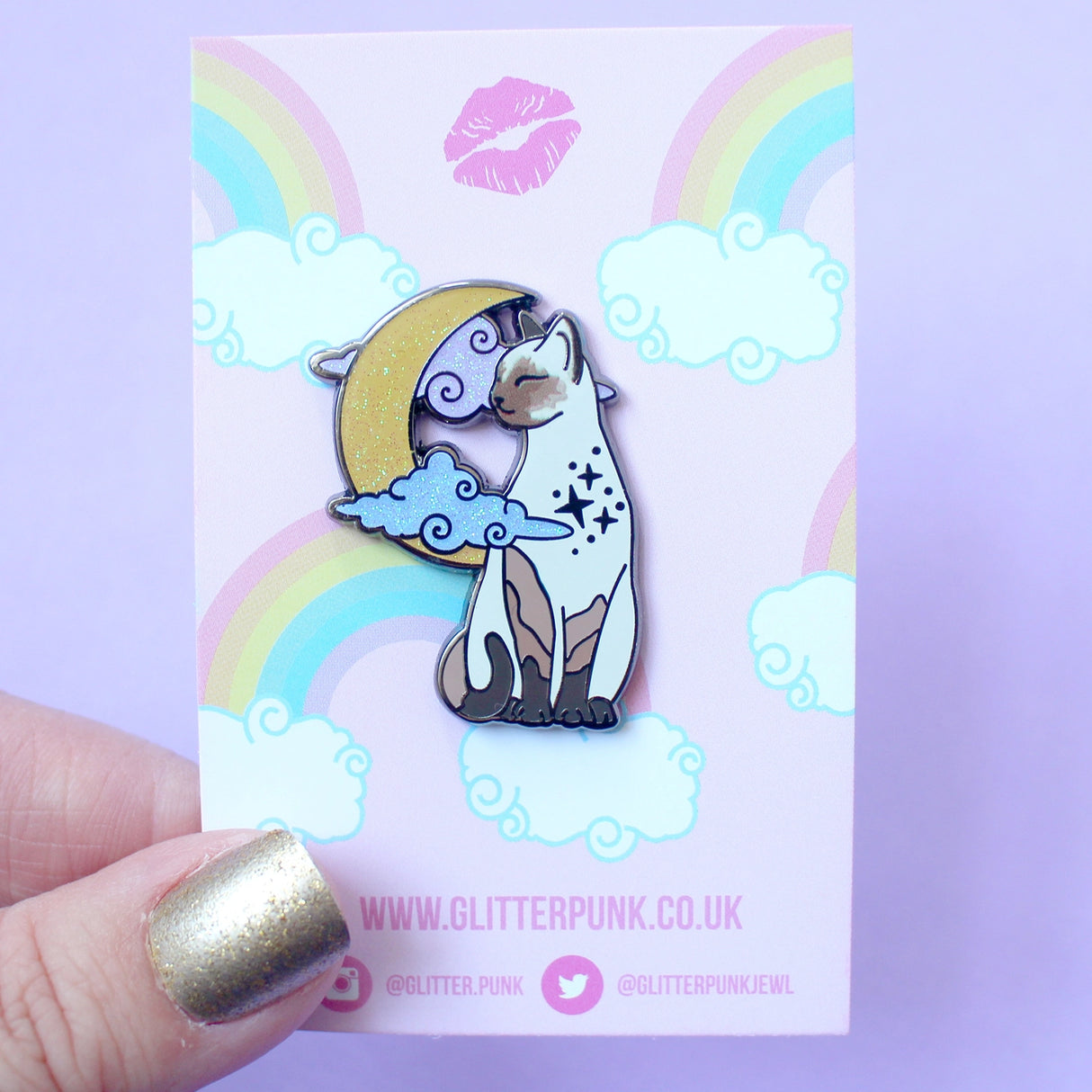 Glitter Punk - Pointed Cat Enamel Pin
Affectionate, clever and loud - there's no feline with the personality quite like a pointed cat!
This super sweet enamel pin depicts a pointed cat in a relaxed moment, in front of a glittery moon and clouds.