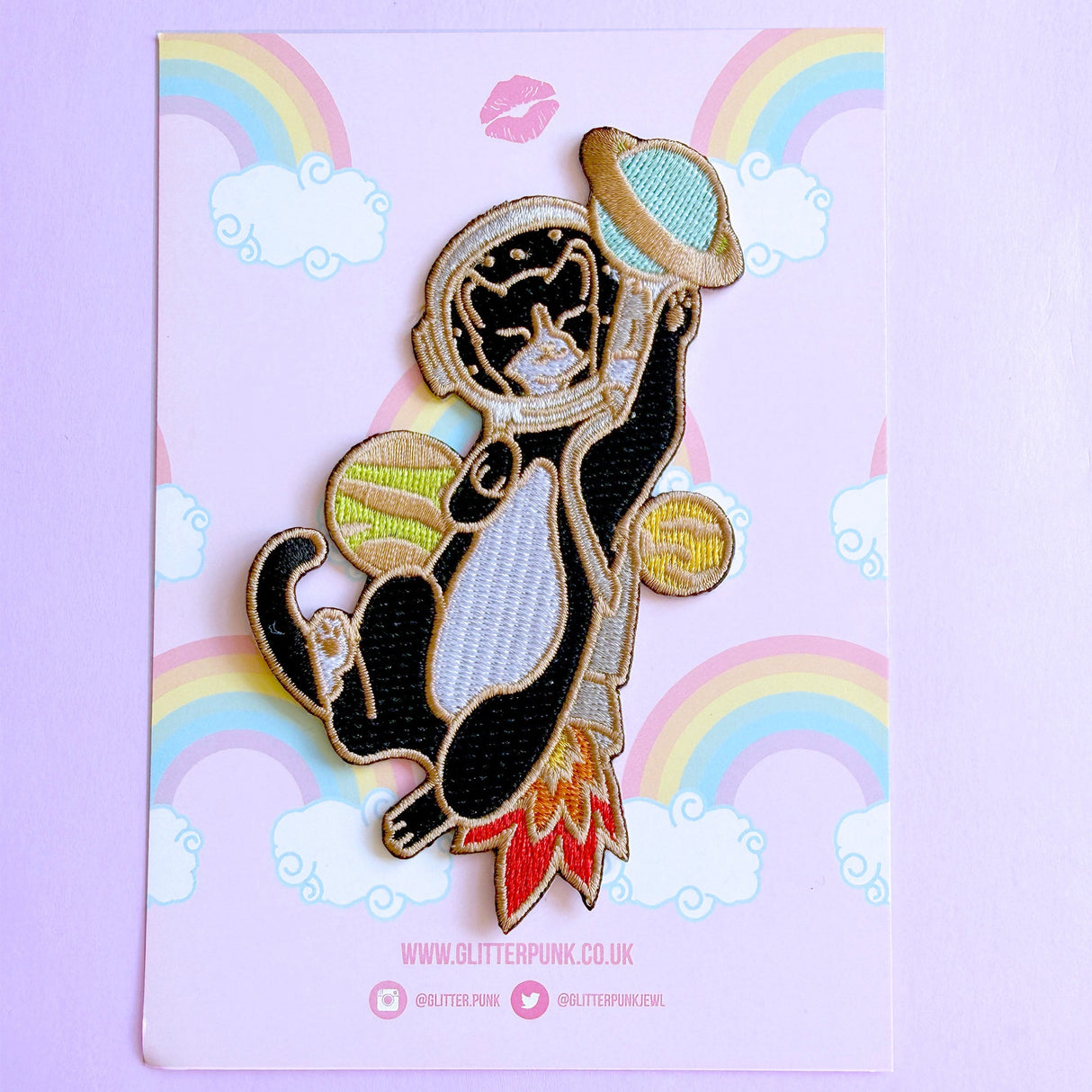 This awesome Astronaut Cat patch features a tuxedo cat with a helmet and rocket ship playing with some planets.
Beautifully woven with multi coloured threads, this fabulous patch with brighten up any coat, bag or hat!
Measurements: 64mm x 110mm