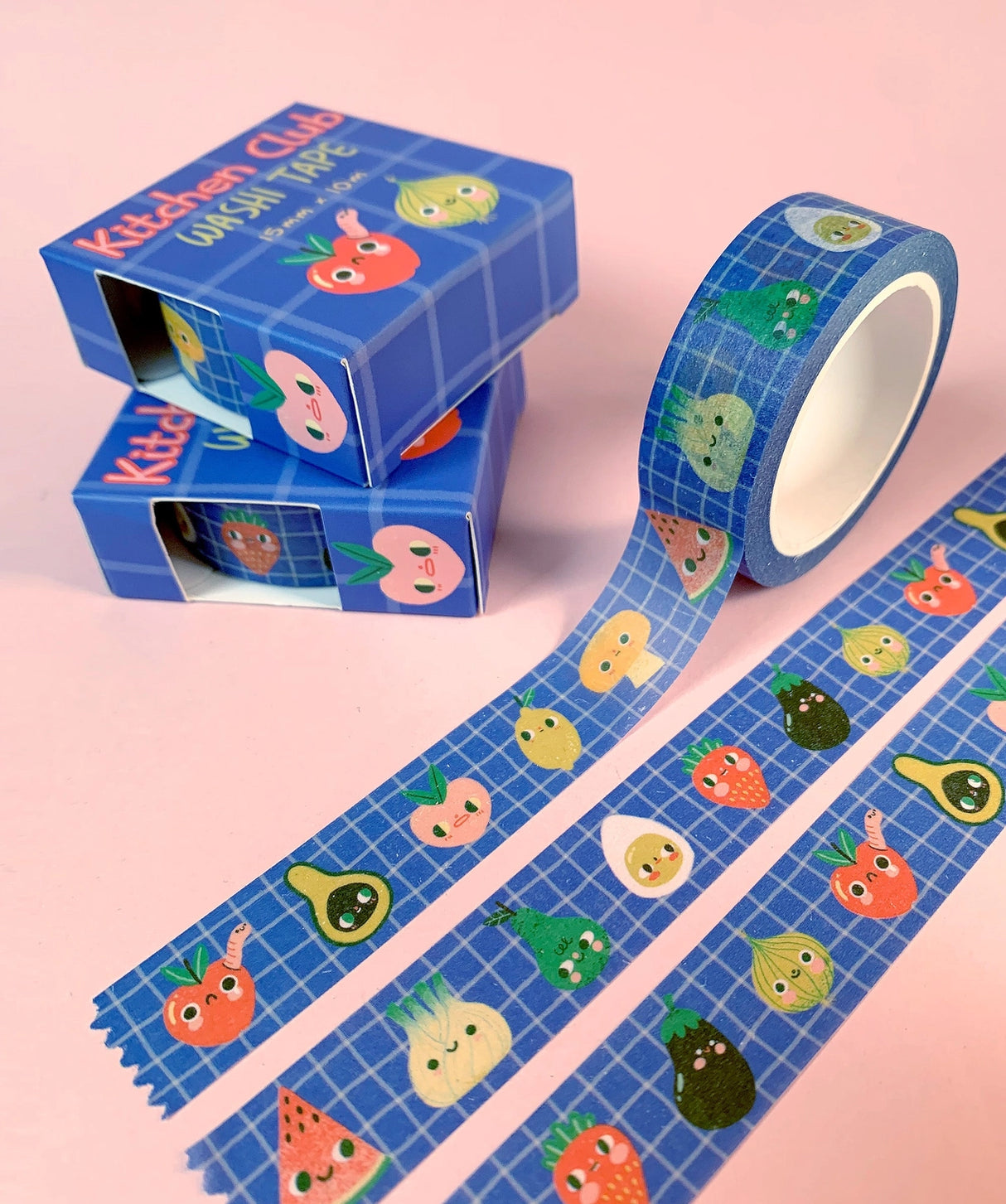 'Kitchen Club' washi tape roll, 15mm H x 10m L, in a recyclable card box.
Cute collection of fruit and veggie pals on a wobbly-check blue background.