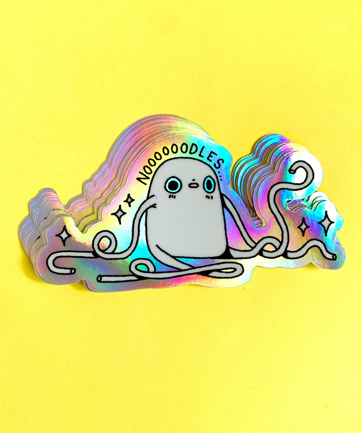 "Noodles" Vinyl Sticker made from Hannakin illustration with holographic accents (background) and shiny gloss finish.
Made from a durable waterproof vinyl with a matte laminate that protects it from scratching, rain and sunlight.