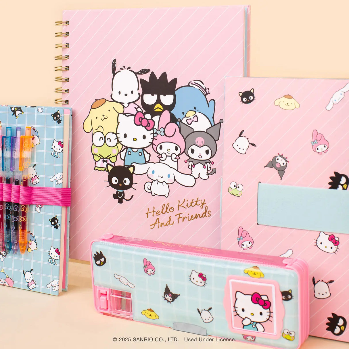 Travel back in time with this multifunctional pencil case, featuring adorable Hello Kitty and Friends artwork. With a built-in calculator, pencil sharpener, and dual compartments for extra storage, this case is as practical as it is cute. Each side holds up to five pens or pencils, plus erasers, paper clips, and more—keeping everything organized and in place with secure magnetic closures. It's the perfect blend of classic charm and everyday function! © 2025 SANRIO CO., LTD. Used Under License.
