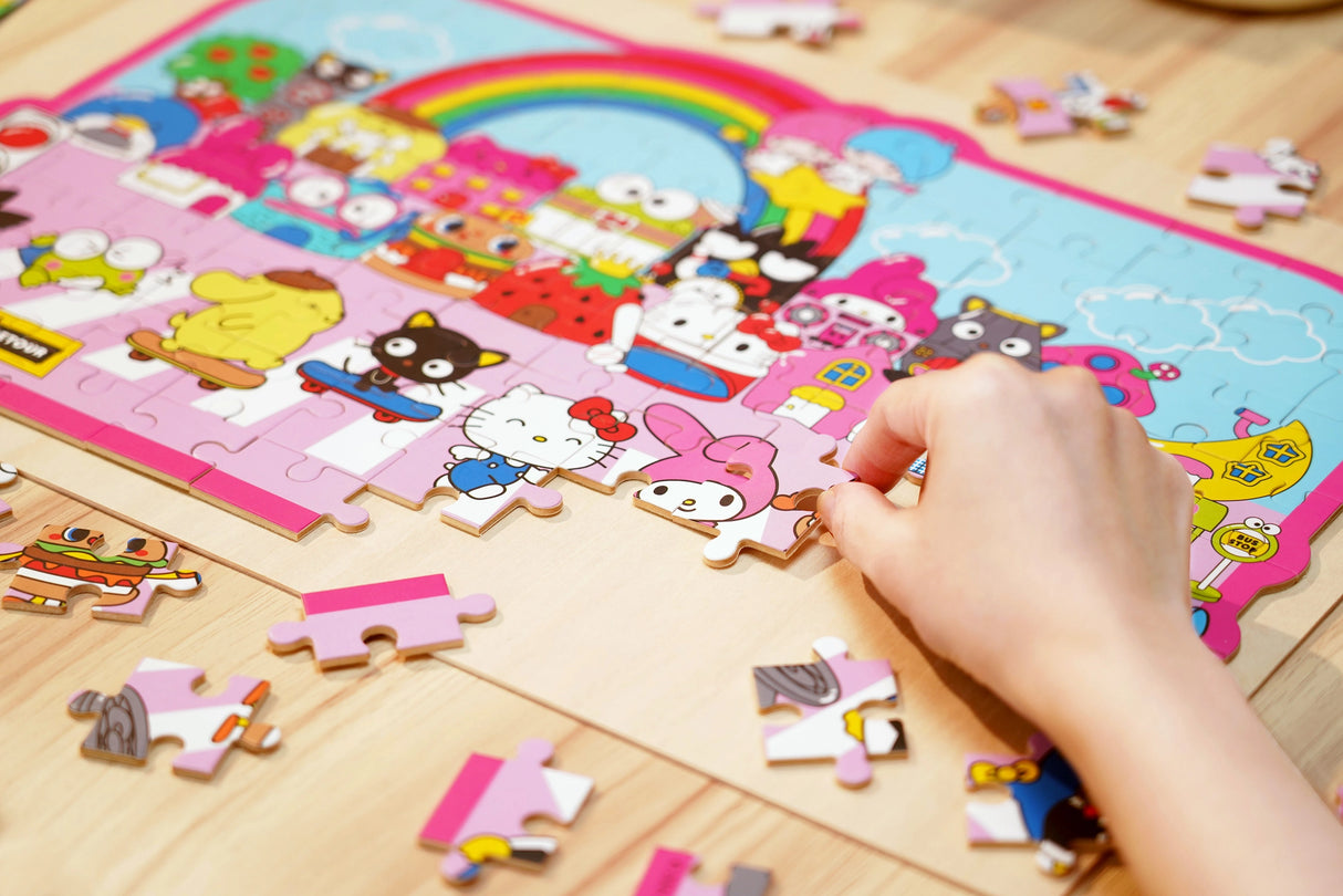 Discover joy with the Hello Kitty Wooden Jigsaw Puzzle: Street with Shops (94pcs). This officially licensed Sanrio product features iconic Hello Kitty in 94 vibrant wooden pieces. Crafted for durability and a seamless fit, it's a delightful challenge for fans of all ages 8+. Embrace positivity and bring Hello Kitty to life with this charming puzzle – perfect for relaxation and family fun. Display your completed masterpiece proudly and celebrate the timeless appeal of Hello Kitty.