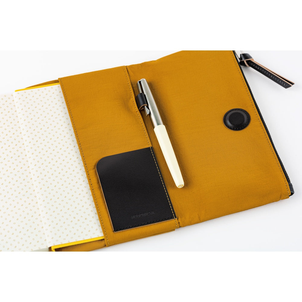 Inside, you’ll find ample storage: a leather pocket on the right side and five card pockets on the left. The pen hook is designed to hold your pen by its clip.