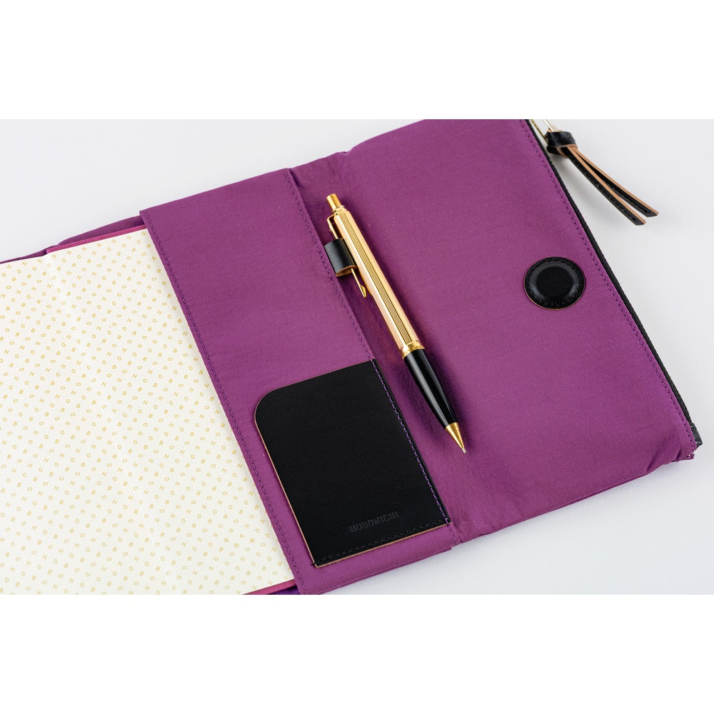 Inside, you’ll find ample storage: a leather pocket on the right side and five card pockets on the left. The pen hook is designed to hold your pen by its clip.