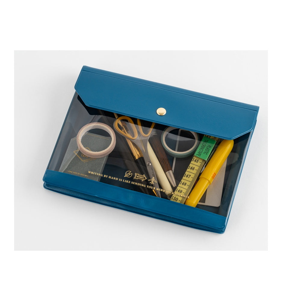 Blue stationery set with various items including scissors, tape, and a ruler in a clear plastic case on a white background.