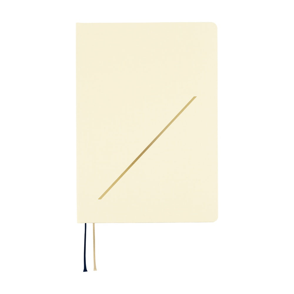 Slash is one of the key design choices for the HON, featuring a hardcover already built into the book. The soft ivory cover is accented with a diagonal slash foil-printed in gold.