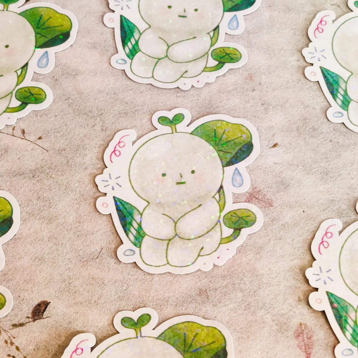 This is a glossy vinyl die-cut paper sticker with star holographic features, illustrated and made in-house by me. It's waterproof and ideal for decorating hard surfaces like laptops, water bottles, and phone cases, adding a cute touch to your belongings.
Material: premium glossy waterproof vinyl