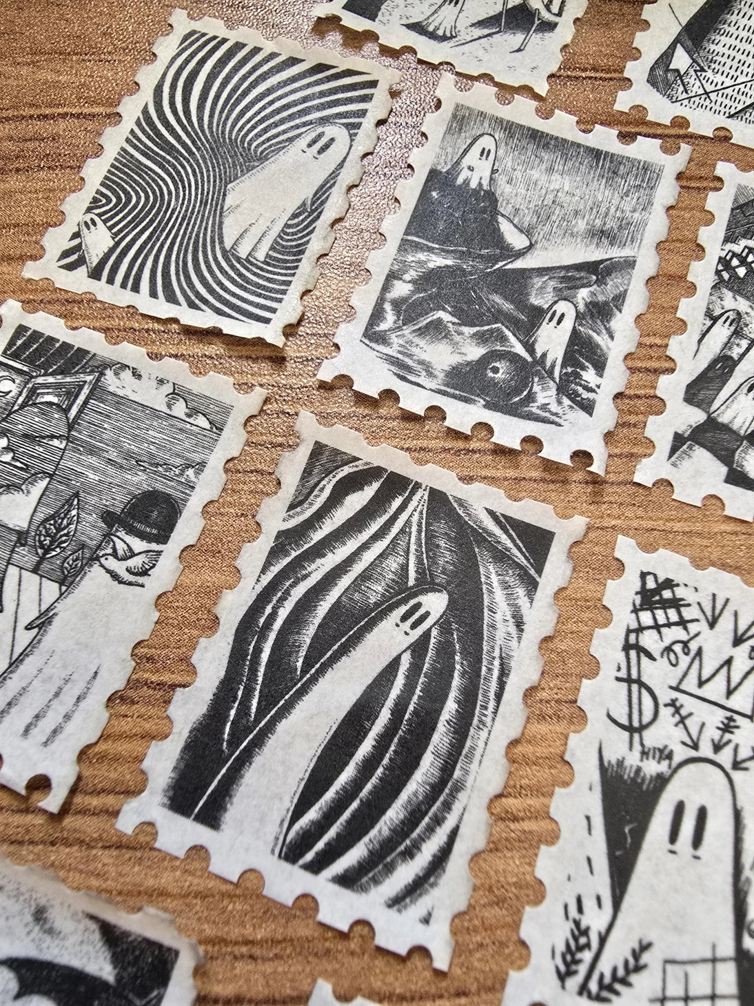 The second of two tapes from the Creative Spirits series by Jon Turner, little ghosties taking you on an eclectic tour of art history. This roll features ghosts inspired by Bridget Riley, Rene Magritte, Hilma Af Klimt, Georgia O'Keeffe, Salvador Dali, Paul Cezanne, Pablo Picasso, Georges Seurat, MC Escher, and Jean-Michel Basquiat.
Perforated to look like a roll of postage stamps, this washi tape features a repeating pattern of ten designs in portrait format from hand-drawn pen and ink artwork, recreated i