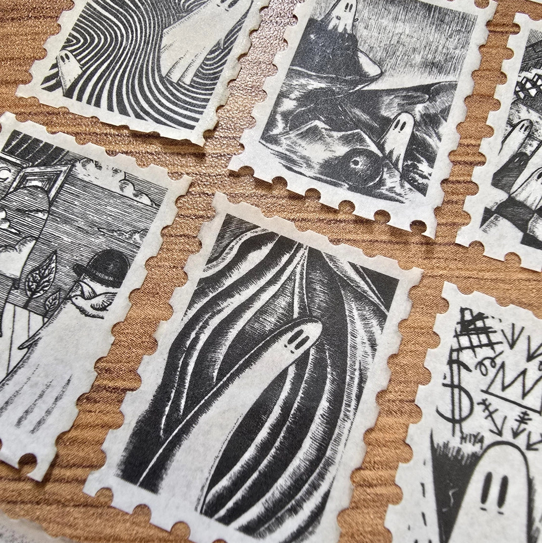 The second of two tapes from the Creative Spirits series by Jon Turner, little ghosties taking you on an eclectic tour of art history. This roll features ghosts inspired by Bridget Riley, Rene Magritte, Hilma Af Klimt, Georgia O'Keeffe, Salvador Dali, Paul Cezanne, Pablo Picasso, Georges Seurat, MC Escher, and Jean-Michel Basquiat.
Perforated to look like a roll of postage stamps, this washi tape features a repeating pattern of ten designs in portrait format from hand-drawn pen and ink artwork, recreated i