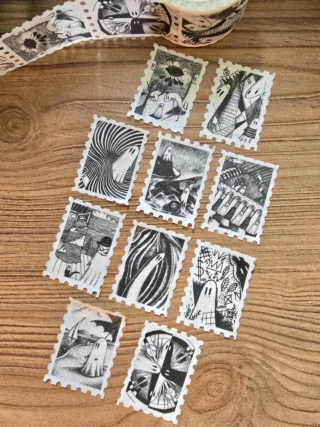 The second of two tapes from the Creative Spirits series by Jon Turner, little ghosties taking you on an eclectic tour of art history. This roll features ghosts inspired by Bridget Riley, Rene Magritte, Hilma Af Klimt, Georgia O'Keeffe, Salvador Dali, Paul Cezanne, Pablo Picasso, Georges Seurat, MC Escher, and Jean-Michel Basquiat.
Perforated to look like a roll of postage stamps, this washi tape features a repeating pattern of ten designs in portrait format from hand-drawn pen and ink artwork, recreated i